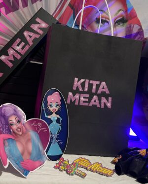 Kita Mean Instagram - Dear everyone,

It is heartbreaking to admit that I am still going through major surgical complications after massive skin removal surgery in October. I have been in and out of hospital for the past 3 months and about to go in for another surgery tomorrow. I am heartbroken that I cannot attend @rupaulsdragcon to meet all of you fucking amazing people that have come into my life since I won RuPaul’s Drag Race Down Under. I pour so much of myself into Drag and I was so excited to hangout with you all and wear some fabulous looks from amazingly talented Aus, NZ and UK designers like @banglondon @hon.atelier @pashion_couture @gridleybyvictoria and @styledbyesther_  As a result of this heartbreaking situation I am left massively out of pocket BUT with a whole lot of fabulous merch packs that were going to be at my Birthday Party themed booth! To try and make some funds while I’ve been off work for the past few months I am selling the limited edition Drag Con Party Bags on my website! (LINK IN MY BIO) if you have the means to and can send me some love, grab yourself a bag! EVERY custom KITA MEAN branded gift bag contains a double enamel pin set, sticker sets, Kita Mean Balloons, a Kita Mean clack fan and a signed print! Ontop of this all orders will be packaged over the next two days and shipped to you before Drag Con! I love you all so much and I am damn determined to heal asap so I can get up and continue being my campy self again. I love you all to the moon and back. 

xx Kita