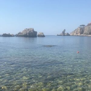 Lara Wolf Instagram - Couldn’t unhear the soundtrack of #WhiteLotus! Can you hear it? Also, cut me some slack for the imperfect #Bond girl walk, it’s a pebble beach 😂#taormina #beach #shannanigans #isolabella 
#laplagehotel #sicily