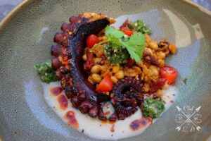 Lawrence Duran Instagram - Grilled octopus/ Navy beans/ Chorizo/ Sun dried tomatoes/Celery leaf chimichurri/ Chili crisp/ Bean purée .
.
.
.
.
.
.
.
.
.
.
#FunFood #GrilledOctopus #Summer #Lunch #FitFoodie #PicOfTheDay #FitFam #IGDaily #InstaFit #FoodPorn #PrivateChef #ChefLife #WahlbergChef #Blessed