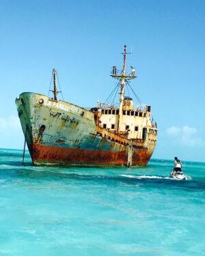 Lin Oeding Instagram - Jet skied to the La Famille Express, an abandoned Russian Navy cargo ship 2 miles off the coast of Turks and Caicos. Built in 1952, it shipwrecked during Hurricane Frances and has sat here since. They say it is one of over 3 million shipwrecked vessles in the sea.
