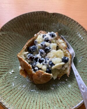Lin Shaye Instagram - 2023 new yummy baked potato with blueberries and sour cream, dab of butter, salt and pepper