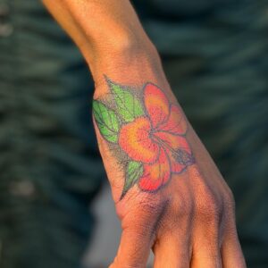 Lindsay Philomene Instagram - ✨ Custom Hibiscus for @sylkiesly 💕✨ 
.
.
.
More colourful flora please ✨ 
To book a custom or flash : Linktree in my bio ✨
.
.
.
#melaninpoppin #floratattoo #neotraditional #montrealtattooshops #boldtattoo #handtattoo