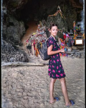 Lorina Kamburova Instagram - True story😀🤘 This is my look, just before I was told that this is a sanctuary of fertility. And the wooden bars behind me turn out to be phalluses😂😅 I said to my man, standing there "that the energy here is special, deep and beautiful, but I am really frustrated about the garbage, left behind it -these big colorful trash". He said to me - "you are so blind, these are phalluses, that fishermen bring to the goddess for prosperity and satisfaction" 
Oh well, I guess I am a true woman after all. At least I am feeling it, if not seeing it 😂
#fertility #sanctuary #goddesses #fishermen #love #phalluses #sealovers #sea #islandliving