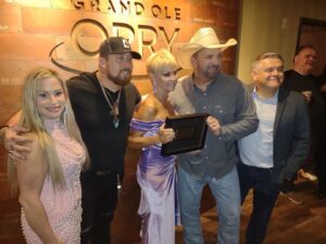 Lorrie Morgan Instagram - So beautiful to have Garth announce that a new plaque with the name Keith Whitley will hang on a wall at the @opry with the members.  Pictured: my daughter Morgan, son - @jessekeithwhitley , @garthbrooks (yes, he IS the nicest person on earth) and @oprydan . What a night!