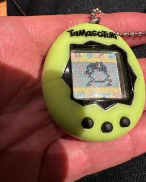 Louis Theroux Instagram - The Tamagotchi is six days old… A lot of care and attention has gone into keeping him alive… A couple of hours ago it evolved into this. My question is… What is it? I can’t find it in any of the Tamagotchi character catalogues. He’s got like a beanie, and big eyes and spindly legs, and he runs back-and-forth. Does anyone know?