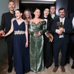 Louise Brealey Instagram - Well that was BATS. I’ve been on a plane all day and the sun has just gone down over the Hudson. 

Last night our little comedy won the biggest prize in the land that a little comedy can win - the Best Scripted Comedy BAFTA. We were all high as herrings on pure shock and joy. And as you can see I was grinning maniacally on stage! 

Thank you to everyone who worked on this show - you are ALL absolute legends. 

#suchbravegirls