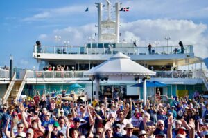 Lyle Lovett Instagram - @norwegiancruiseline Pearl, Puerto Plata, Dominican Republic, 3/3/24: It’s the @journeythroughsong community that makes Cayamo so special to play. @sxmliveloud makes its passengers feel so at home and so welcome, folks keep coming back year after year. Four or so rows back on the left side of the picture, the man in the green ball cap, is my friend John O’Neill, from Dublin, Ireland. I met John on the first Cayamo. He and his wife, Noeleen, come every year. Getting to know and spend time with the people who support our music—on Cayamo and around the world—is a privilege for all of us who play.