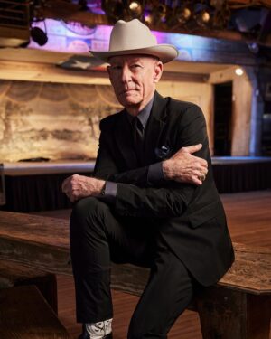 Lyle Lovett Instagram - Legendary musician and actor Lyle Lovett wears his own personal Pure Open Road in Alabaster. Shot on location at the iconic @gruenehall in Gruene, Texas, where Lovett played some of his earliest gigs as a musician. 
 
Over a career that spans more than four decades, @lyle_lovett solidified his status as one of country music’s most iconic and iconoclastic voices, crafting songs that defy categorization, borrowing from jazz, gospel, Texas swing, and the blues to create a hybrid sound that’s all his own. A born-and-bred Texan who grew up outside Houston in the town of Klein, Lovett combines a veneration for tradition with a healthy sense of irreverence, as witnessed by his playful and often mischievous lyrics. It all comes from an authentic place, he says: “I write about things that feel real to me, things that really happened, things I really see. I don’t have to write songs. I just have to write them down.”
 
Those songs have taken Lovett from the Grammys to Hollywood, including memorable turns in four Robert Altman films. While he’s been known to wear a Prada suit with his Stetson and custom-made cowboy boots, he’s also a longtime rancher and rider (with the scars to prove it) and remains a true Texas gentleman to his core, with an ever-expanding personal collection of Stetson Open Roads. His first was inherited from his grandfather in 1979. His most recent? The Limited Edition 20X in Butterscotch that he picked up just last fall. “My grandfather always wore an Open Road to church,” Lovett says. “So to me, the Open Road was always the dress version of a cowboy hat. It has a cattleman’s crease in the crown and a conservative brim, so you’re not showing off.” 
 
#OpenRoadCharacterDriven
#ItsAStetson

📷: @stevenvisneauphotography
