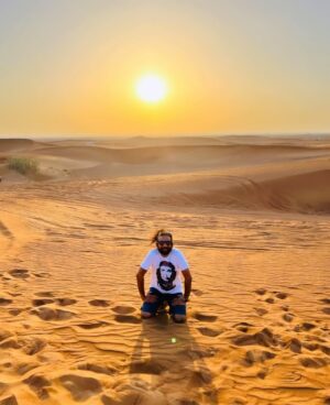 Maris Vijay Instagram - “The desert sunset, a breathtaking symphony of fiery colors, paints the horizon with its celestial brush.”#desert #sunset #sun #falcon #dubai #desserts #desertsafari #desertstorm #desertwildlife @marisvijayofficial @trinity_waves_studio @mmuzikofficial @marisvijayfanpage