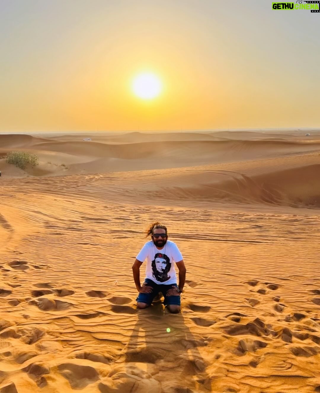 Maris Vijay - 115.5K Likes - “The desert sunset, a breathtaking symphony of fiery colors, paints the horizon with its celestial brush.”#desert #sunset #sun #falcon #dubai #desserts #desertsafari #desertstorm #desertwildlife @marisvijayofficial @trinity_waves_studio @mmuzikofficial @marisvijayfanpage