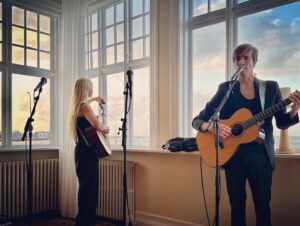 Markéta Irglová Instagram - In the historic building Höfði in Reykjavík I got to perform with my friends on John Lennon’s birthday, October 9th, during the annual ritual of turning on the Peace Tower of Light created by @yokoono 

Höfði is a bulding of historic significance because it is where Reagan and Gorbachev met to discuss reaching a peaceful resolution and bringing an end to the Cold War. 

The irony of that can not be lost on one during these times. History is on repeat and it shall be so until we either evolve or self-destruct. The choice rests with each and every one of us thought it may not always feel that way.

I pray for peace for all people everywhere, and I mourn the lives lost, just as I weep for the Earth who also feels the pain of all the destruction. Please God, may the horrors end, for the sake of us all and our future. 🙏🤍🕊️