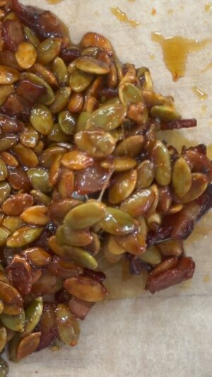 Matt Preston Instagram - How to take simple pumpkin soup to the next level…. Pepita Crunch time! Chewy, nutty, salty, sweet, hot!
Fry bacon. Toast thrice as many pepitas in the rendered fat. Add maple syrup and cook do it gets stickier. Stir in half as much sriracha. Add salt. Use the fat and the set crunch on your simple pumpkin soup. Done