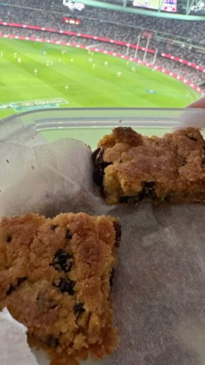 Matt Preston Instagram - Amanda’s slice, the football and a nice cup of tea. Perfect! #gopies  RECIPE.  220g raw sugar
1 egg
150 g self-raising flour
2 good tsps golden syrup
160 g sultanas
100 g butter, melted

Preheat the oven to 180°C. Grease and line a 20 x 30 cm or 24 x 24 cm slice tin. 

Combine all the ingredients, except for the melted butter, in a large bowl. Pour in the melted butter and use a wooden spoon to mix everything together well.

Press the dough into the prepared slice tin and bake for around 25 minutes. Cut while warm.