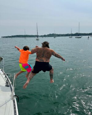 Matty Matheson Instagram - SAILING IS COOL JUMPING OFF SAILBOATS IS COOLER HOLDING YOUR SONS HAND JUMPING IN THE LAKE IS THE BEST EVER THANK YOU @wyldewoodsurf @lindssssssssssssssssss FOR A GOOD ONE