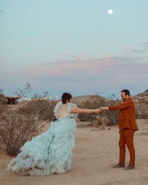 Melanie Field Instagram - #OTMBride @melanie__field and Zachary Likins first matched on @bumble. 🐝 A year and four months later, he proposed while on a trip to see her family in Philadelphia. 💍 Once engaged, the couple agreed they wanted to share their love of the desert 🏜️ with their friends and family and get married in Joshua Tree. 
⠀⠀⠀⠀⠀⠀⠀⠀⠀
For the ceremony, Mel aimed to wear something unique. “I wanted to look and feel regal like a princess but from another universe,” the bride says of her wedding dress vision.🪐🛸💙👑 “And I knew I wanted tulle and lots of it, so I could just plop down on the ground in a pile of tulle. 
⠀⠀⠀⠀⠀⠀⠀⠀⠀
The bride found @millia.London and the label’s designer, Ruth, made her dream come to fruition. “As a plus size woman, I’ve spent most of my life feeling very excluded from high fashion. My experience with Millia London was not only lovely but healing in many ways,” Mel shares. “I didn’t have to settle on my special day, and I one-hundred percent felt like the wormhole space princess who fell from the sky—just like I dreamed I would.” 👰🏻‍♀️

#OTMWeddings #OTMExclusive #DesertWedding #CaliforniaWedding
⠀⠀⠀⠀⠀⠀⠀⠀⠀
📷: @wearemattandjess
Planning: @yuandus
Beauty: @angiebulmer @dear_shears
💐: @desertrose.creative
Catering: @mojavedesertcharcuteriecompany @sohotaco
🎶: @whosjondoe
🍰: @picnicbakedgoods