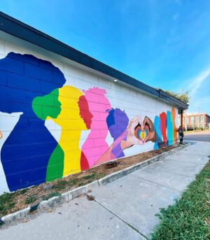 Melanie Posner Instagram - When looking at this mural you wouldn’t know that it’s unfinished. It was supposed to have a tagline at the top that read “It takes every community,” with a QR code that led to The Ryan White Care Council’s website. This mural was fully funded by this organization to raise awareness and beautify the community. Unfortunately the building owner of where this is located changed his mind mid project (because he donated his wall to us) and I had to stop painting. We sadly had to leave this project unfinished for 6 months. All this time- behind the scenes- despite getting threatened for trespassing or defacing property if I finished the mural, I fought so it could be complete. The message in my art is so important to me. I wanted to portray diversity, inclusivity, and togetherness. With the state that Florida is in right now we need that more than ever. So after blood, sweat, and tears I’m glad I could finally come back and leave the neighborhood with this. Always fight for what you believe in 🫶🏼It’s located on the side of Nicko’s Pizza in DTSP ❤️ Please note that the pizza shop was in equal outrage as me, they just rent from the building owner, and you should go support them. 
.
.
.
.
.

#DTSP #stpetemurals #stpeteart #muralartist #lgbtqart #womenwhopaint #stpetersburgfl