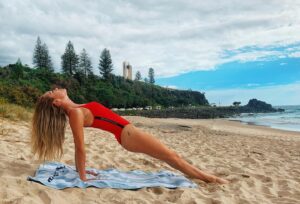 Melina Vidler Instagram - When the cops catch you sunbathing ... 🧘🏼‍♀️ .
.
.
#yoga #prelockdown #beachyoga #exerciseonly #tommyhilfiger #redbikini #beachexercise #goldcoast #australianbeaches #selfisolate #tommyhilfigerswimsuit #beachhair #salty