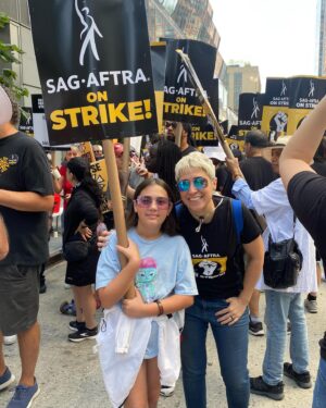 Melissa Navia Instagram - On the picket line this week with my niece & @the_furious_owl! Thank you to all the friends & family members & sister unions who have been fighting with us. Standing together is everything. Solidarity is why we know we will win. ✊🎭 I owe so very much of my ability to endure and succeed in this business to my family and my Brian, who have always and fervently supported my ambitions and championed my efforts.

I have found that the people you surround yourself with are as important to artistic success (and sanity) as everything you yourself bring to the table, not least of which is that burning, at-times inexplicable passion from deep within that urges you in even the darkest moments to “never give up, never surrender!”

I cannot wait to get back to work, to get back to doing what I love with a supremely talented cast & crew of storytellers. Until then, a life of uphill hustling has primed all us working actors & writers for this moment. However long they think we can go, we can go longer. Because the future of our industry is at stake. Because we deserve fair contracts, respect, transparency, and living wages for the work we do and the stories we look forward to getting back to telling.

@sagaftra @sagaftrafound
#SAGAFTRAstrike #SAGAFTRAstrong