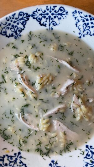 Michael Symon Instagram - Agvolemono Soup 🍋 aka Greek penicillin… this was the soup my mom always made for me when I didn’t feel well and it’s still a hit in the Symon household… enjoy 

Avgolemono Soup 
Serves 6-8

For the broth:
1 whole chicken
2 bay leaves
1.5 gal water

For the Soup:
3 eggs
Juice and zest of 3 lemons
2 tbl Wondra flour
¼ c fresh dill
1 lb. cooked orzo pasta
Salt and pepper to taste

Place whole chicken and bay leaves in a pot with 1.5 gallons of water. Bring to a simmer and cook for 1.5 hours.
Strain broth, save both the chicken and the broth. Place broth back into the pot and bring to a simmer.
Whisk  the eggs, lemon juice, zest, and the flour in a bowl until smooth.
Temper the lemon and egg mixture with 1 cup of the hot broth. Slowly whisk the egg mixture into the pot of simmering broth.
Allow to simmer for 10 minutes. Add ¼ cup of chopped fresh dill.
Meanwhile, pull the meat off the chicken.
Place one handful of cooked orzo and one handful of pulled chicken in a bowl. Cover with hot broth, season with salt and pepper. Enjoy.