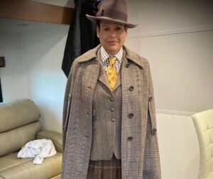 Michele Clapton Instagram - The Peripheral costumes.  Lowbeer (Alexandra Billings)
The idea for creating this costume along with many of the other costumes in this particular group for 2100 London came from the idea that they could recreate anything from the past but over time the details became lost or remembered differently. Wilf’s coat and jacket are another examples of this.  Cutter Mel Carter.  Buyer Klaire Jamin.  Illustrator Oliver Doherty.  Assistant Designer Molly Langford.