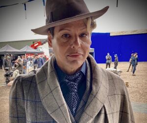 Michele Clapton Instagram - The Peripheral costumes.  Lowbeer (Alexandra Billings)
The idea for creating this costume along with many of the other costumes in this particular group for 2100 London came from the idea that they could recreate anything from the past but over time the details became lost or remembered differently. Wilf’s coat and jacket are another examples of this.  Cutter Mel Carter.  Buyer Klaire Jamin.  Illustrator Oliver Doherty.  Assistant Designer Molly Langford.