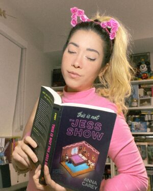 Michelle Grondine Instagram - Q: if you could live in any fictional world, which world would you live in, even if you knew you might not be able to return to your own reality? 

HAPPY BOOK BIRTHDAY TO ✨𝑡ℎ𝑖𝑠 𝑖𝑠 𝑛𝑜𝑡 𝑡ℎ𝑒 𝕁𝔼𝕊𝕊 𝕊ℍ𝕆𝕎✨ by @annacareybooks !!!!!!! which is out from @quirkbooks ᴛᴏᴅᴀʏ 🥳🎉

i am currently in the thick of this book—a Black Mirror meets My So-Called Life with maj YA The Truman Show vibes—and loving every second. i will not disclose whether i am reading slowly because i am trying to make this world last for me (does anyone else do this???)

when this Ithaca College alumni saw the main character, Jess, was simping over a thrifted tee that upstate new yorkers will know dearly and love, i knew i was in for a treat.

jess’s voice is charismatic, inviting, and engaging, and i feel like i’m hanging out with one of my best friends when i’m reading along, which is one of my favorite feelings to experience when i’m reading.

i’ve recently come to the realization that stories that examine the gap between fiction and reality are the stories i gravitate toward the most. 

two of my most recent fav kdramas—W and extra-ordinary you—are both about the line between reality and the manhwa world.

if you are like me, and you love stories that ruminate the line between fiction and reality, This Is Not the Jess Show is for you. 

further, i have an 110-film (at present) letterboxd list titled, “what is reality?” comprised of films that i have watched which are meditations, ruminations, and explorations on the nature of reality and existence. find me @tediously_brief or click the linktree in my bio for a link to the curated film list :))

could be more excited for everyone to also finally get to read This Is Not The Jess Show !!! peep the comments for the full synopsis of the book!