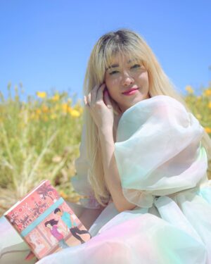 Michelle Grondine Instagram - aloha book nerds and pals 💞 your friend michelle here ✨ happy asian american pacific islander heritage month !!! ✨ this month, which is also my birth month & mental health awareness month, i will be doing my best to highlight & share some of my favorite books, films, and shows by my favorite asian & asian american creators! 

as you may or may not know, i was raised in tokyo, japan for most of my youth until i left home for college at 18. i studied japanese literature in HS, & grew up religiously reading manga. one of my goals i set for myself 2 yrs ago was to start reading japanese texts in both its original japanese as well as its translated english to get a feel for japanese stories & translations better, & see how a story exists in multiple languages. i hope to be able to continue on my journey this month, & through sharing my experiences, maybe inspire others to pick up some books by japanese authors, as well as other asian & asian american authors.

one of my favorite asian american authors is @sarahkuhnbooks. her novel I Love You So Mochi is such a heart-filling comfort read, & her Heroine Complex series is so fun & iconic—starring a biracial japanese personal assistant to a female superhero who is her childhood friend. Kuhn’s newest book, FROM LITTLE TOKYO, WITH LOVE, comes out May 11, 2021 from @penguinteen. i love that this book stars a “biracial girl with formidable judo skills & a fiery temper” who “knows she’s the least princess-like person in all of LA.” then, when a series of tantalizing clues start pointing to Rika’s mom being alive *&* a huge Hollywood movie star, it’s the start of a madcap quest—complete with the help of a dreamy sidekick in actor Hank Chen by her side. i’m quaking to find out what happens !!! i just know i’ll be experiencing the full range of emotions represented in the photo series above.

congratulations again to @sarahkuhnbooks & @penguinteen on this stunning release, i’m absolutely obsessed with the cover, & so excited by the existence of stories like this one. thank you for the dedication to the halfie club, & thank you for believing in our happily ever after.

Q: what’s an asian american book on your tbr this month?