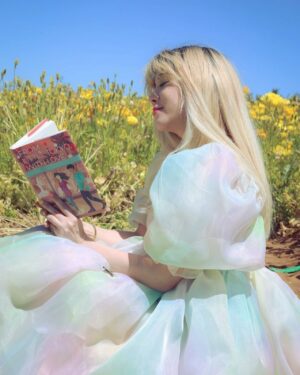 Michelle Grondine Instagram - aloha book nerds and pals 💞 your friend michelle here ✨ happy asian american pacific islander heritage month !!! ✨ this month, which is also my birth month & mental health awareness month, i will be doing my best to highlight & share some of my favorite books, films, and shows by my favorite asian & asian american creators! 

as you may or may not know, i was raised in tokyo, japan for most of my youth until i left home for college at 18. i studied japanese literature in HS, & grew up religiously reading manga. one of my goals i set for myself 2 yrs ago was to start reading japanese texts in both its original japanese as well as its translated english to get a feel for japanese stories & translations better, & see how a story exists in multiple languages. i hope to be able to continue on my journey this month, & through sharing my experiences, maybe inspire others to pick up some books by japanese authors, as well as other asian & asian american authors.

one of my favorite asian american authors is @sarahkuhnbooks. her novel I Love You So Mochi is such a heart-filling comfort read, & her Heroine Complex series is so fun & iconic—starring a biracial japanese personal assistant to a female superhero who is her childhood friend. Kuhn’s newest book, FROM LITTLE TOKYO, WITH LOVE, comes out May 11, 2021 from @penguinteen. i love that this book stars a “biracial girl with formidable judo skills & a fiery temper” who “knows she’s the least princess-like person in all of LA.” then, when a series of tantalizing clues start pointing to Rika’s mom being alive *&* a huge Hollywood movie star, it’s the start of a madcap quest—complete with the help of a dreamy sidekick in actor Hank Chen by her side. i’m quaking to find out what happens !!! i just know i’ll be experiencing the full range of emotions represented in the photo series above.

congratulations again to @sarahkuhnbooks & @penguinteen on this stunning release, i’m absolutely obsessed with the cover, & so excited by the existence of stories like this one. thank you for the dedication to the halfie club, & thank you for believing in our happily ever after.

Q: what’s an asian american book on your tbr this month?