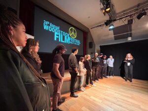 Michelle Krusiec Instagram - Thank you @woodstockfilmfestival for an event filled weekend including a loudly cheering audience for Nian. I watched the mind blowing film INVISIBLE NATION (more on that in a separate post) directed by gifted storyteller @vhopeful. Met award winning filmmaker @brewsterjoe, Nian played alongside his film Black Girls Play also directed by Michele Stephenson. Met father of indie filmmaking Victor Nunez whose film Rachel Hendrix starring Lori Singer won best narrative. And I love when I get to hang with programmers like Amanda Naseem. Our film Nian was nominated for the Mark Braunstein Maverick Award 🙏thanks Charlee Liebskind, Meira Blaustein for the recognition. The awards ceremony honored James Ivory who is 95 and won an Oscar at the age of 87! So moving. My tee is 70s vintage anti police brutality slogan, perfect for Woodstock.