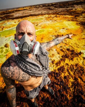Mike Corey Instagram - My feet have widened and calloused.
My mind has done the same.
I’ve stopped wearing shoes and underwear.
Sunscreen and deodorant.
3 Million years an ape. 100 years a consumer.
I’ve learned to trust my body.
Not TV commercials and advertising.
I now question things more. Not because I don’t believe, but because I want to see if they do.

They tell white lies through golden teeth, 
Sanitizer for my hands, Insoles for my shoes, pills for the pain, 
A fake plastic coating over the true human experience.
We’re being sold the solution, after being sold the cause.

Comfortable and convenient options for everything. We’re soft like the marshmallow we eat. 
 Our mind and body have stopped trying. They only work as much as they have to.
The solution is not easing the pain. It is pain. It is not curing to suffering, it is suffering.   Neither can be avoided. Unfortunately it is the human condition. We’re a species given everything we’ve ever wanted and we’re more miserable than ever.   Finding meaning in your pain and suffering is the only way to be free of it.

Your body is an amazing tool. A weapon of mass adaptation. We just don’t give it a chance.

So the next time you’re outside, take off your shoes and walk in gravel for a while.
The next time you’re in sun, take in those beautiful rays without the sunscreen for a bit.
The next time you have a meal, eat with your hands, maybe even forget wash them.

Do these gently at first, it takes time. 
People ask me how I survive these expeditions, how I rarely get sick, and how I handle the hottest and harshest places on the planet. 
It’s because I trust my body. I test it all the time. Saunas, sun, earth, ice and sweat.

Humans do have a superpower. A hidden ability that has allowed us to outcompete everything else in nature. It’s Adaptation, and for some reason, we are hellbent on destroying it.

Like the callouses on your feet, the tan on your skin, your iron gut, or your bulletproof patience
It does not come from comfort. It comes from challenge. Your superpower does not come from comfort.  It comes pain and suffering. It comes from challenge. 🐉

Photo by @bmcreative.video 
Trip by @the_vigillant