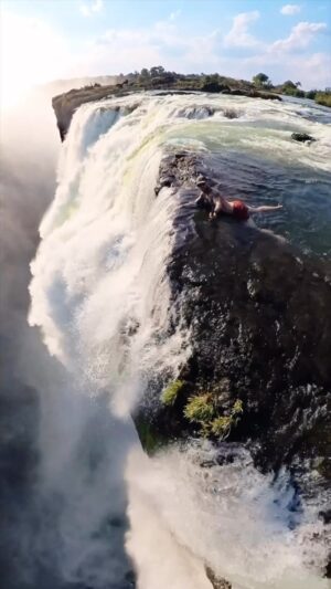 Mike Corey Instagram - The best kind of infinity pool in Zimbabwe 🇿🇼🔥
#travel #adventure #waterfall
