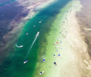 Mike Theiss Instagram - Happy Sandbar Sunday everyone !! Boats anchored along the iconic Whale Harbor Sandbar in Islamorada, Florida. TAG a friend you want to party on this sandbar with. Photo by Mike Theiss @ExtremeNature
