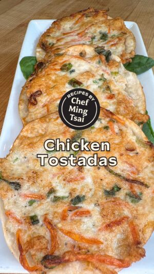 Ming Tsai Instagram - An easy recipe for leftover dumpling mix, Chef @Mingtsai’s Chicken Tostadas! 😋⁠
⁠
INGREDIENTS: Tostadas⁠
- 1 package Dumpling Wrappers⁠
- Cheddar cheese⁠
- Leftover Dumpling Filling (see recipe below) ⁠
- Neutral oil⁠
- Kosher salt and freshly ground black pepper⁠
⁠
INSTRUCTIONS⁠
1) Have a small bowl of water and spoon ready on your workstation. ⁠
2) Lay out your dumpling wrapper on a dry surface. Place about 1 tbsp of cheddar cheese in the center of each dumpling wrapper. ⁠
3) Using a spoon, place about 1 ½ tbsp of your dumpling filling on top of the cheese. Wet the back of your spoon with water. Using the back of your spoon spread the dumpling filling gently over the cheese to the edges of your wrapper. Repeat to make the desired amount of tostadas. ⁠
4) Add about ⅛ of an inch of neutral oil in a cast iron skillet over medium-high heat. Once hot, place tostadas wrapper side down until GBD (golden brown and delicious). Flip over to cook chicken and melt cheese. Once cooked, place on a paper towel lined plate to drain excess oil. Repeat until all tostadas are cooked. ⁠
5) To serve, place tostadas over greens and ENJOY! ⁠
⁠
INGREDIENTS: Dumplings⁠
- 1 pound of ground chicken⁠
- 1 ½ cups shredded carrots⁠
- 6 scallions, sliced greens and whites⁠
- 4 tbsp fish sauce⁠
- ¼ cup ripped thai basil (smack the basil to release flavor before ripping) ⁠
- Freshly ground black pepper to taste⁠
⁠
1) In a large bowl mix all ingredients together. ⁠
⁠
Pro Tip: To test the flavor of your filling, take about a tsp of your filling and microwave it until it is cooked through. Taste and adjust the seasoning to your liking. ⁠
⁠
🌟 Make sure to SAVE this recipe to remember to make later! 🌟⁠

#tostadas #tostada #easyrecipeideas #recipeideas