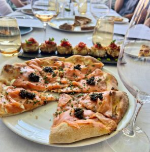 Ming Tsai Instagram - The best lunch table in town.  Always a delicious meal @spagolv Chef @wolfgangpuck your team did you proud! Always the Smoked Salmon Pizza to start. Thanks  Chef @_alexismarie04 and culinary team for taking care of us!  Best day #deadforever @bellagio