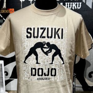 Minoru Suzuki Instagram - SUZUKI DOJO Tee

¥5300-
Pyramid Khaki
Treasure Black

@piledriver_harajuku 
完成しました！スズキドージョーTシャツ！
ファッションの街・原宿に新たにオープンします！(…しません)
7/11 14:00より、原宿店舗およびECサイト www.piledriver.jp 同時発売。どちらのカラーもS. M. L. XL. XXL. XXXL…6サイズと豊富に揃えました。それとスペシャルな特典を付けました。
「SUZUKI DOJO Premium Member」の書かれた道場の会員証ステッカー付き。カラー名は名前から想像してくれ。
今日からキミもスズキドージョーメンバーだ！

あくまでも架空の道場です。。