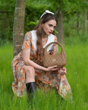 Miray Daner Instagram - Let’s go on a nature trip with @miumiu 🍃🪷 
#MiuMiu #MiuWander 👛 
#reklam