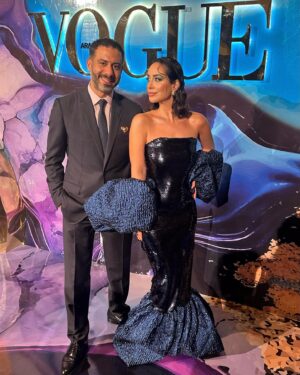 Mohamed Faraag Instagram - He’s the Prince Charming to this Mermaid 🧜🏻‍♀️🧿

We had a ball at the Vogue Ball ✨

Thank you @voguearabia @mrarnaut for having us 🫶🏼

Look curated by @dimaayad 
HER 
  Dress @dimaayad 
  Jewelry @begumkhan 
  Shoes @prada 
  Makeup @rehamkhalifaa @charlottetilburyarabia 
  Hair @rosannagracehair 
 

HIM
  Full look @dior 
  Brooch @begumkhan 

PR @daccomms 
📸 @dazlproduction