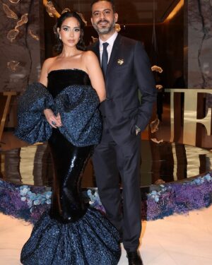 Mohamed Faraag Instagram - He’s the Prince Charming to this Mermaid 🧜🏻‍♀️🧿

We had a ball at the Vogue Ball ✨

Thank you @voguearabia @mrarnaut for having us 🫶🏼

Look curated by @dimaayad 
HER 
  Dress @dimaayad 
  Jewelry @begumkhan 
  Shoes @prada 
  Makeup @rehamkhalifaa @charlottetilburyarabia 
  Hair @rosannagracehair 
 

HIM
  Full look @dior 
  Brooch @begumkhan 

PR @daccomms 
📸 @dazlproduction