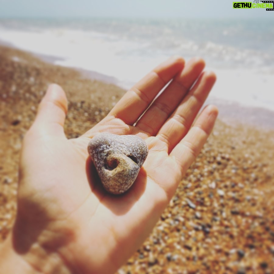 Natalie Gumede - 564 Likes - It caught my eye amongst millions
This stone with a swirl at its heart
Its form of love, with a crashing wave
Mirrors the ways I want life to restart
Perhaps its imprint is from a shell?
Edges surely, smoothed by the sea?
A lesson - as I emerge from a personal hell
Of how we are meant to be
Yielding, morphing, staying strong
Nature won’t assign these emotion
From the years a pebble is broken down
It eventually becomes the ocean
I felt the breaking, yet drowned by the waves
In a vast beach I tried to hide
But this rock sat proud, with its perfect flaws
Asking ‘when will YOU turn the tide?’ My shape isn’t perfect, my edges still rough
Sea spray tastes the same as my tears
But sharpness can soften; I know I’m enough
And our love can stand out from fear
It’s good for ego to remember
We’re naught but a grain of sand
But sometimes we need the reminder
The soul has bigger things planned
Pebble Heart holds the answer
To sensing the storms of the sea
‘When you feel small compared to the ocean
See the ocean is also in me.’ 24/05/20 - Thanks Pebble Heart!
Sometimes I write poems to make sense of how I feel. I rarely share them. And if I do, only with a few people. I saw this pebble today. And I decided to be brave 💙💛💙💛💙💛💙💛💙💛💙💛💙
#poetry #poems #healing #selfhelp #wellness #mentalhealth