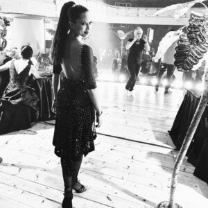 Natalie Gumede Instagram - Taking my moment in the onset melee. YES fishnet tights, YES dance shoes, YES sequins, YES whacking great hair piece. Feeling very happy and grateful for this one ❤️🎥💃🏽#filming #tvseries #actor #actress #dance #stage #footlights #onset #setlife #dancer #dancing #onlocation #tvdrama #concerthall