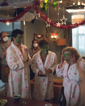 Natalie Gumede Instagram - Merry Christmas Everyone! Hope you’ve all had the kind of day that suits you 🥳here’s some BTS shots of #yourchristmasormine 
1. Dressing gown gang (with fans for me and @theangelagriffin because - fleecy dressing gowns in July🥵)
2. Kaye’s boots that you never saw in shot but I LIVED for
3. Nails that I thought looked good that long  when I went to the salon but I couldn’t do DAMN THING WITH (I’m not a nails person)
4. UK JULY SNOW! 🤩
5. End of shoot applause for the incredible #JuneWatson 
6. Fabulous makeup and hair designer @emilybilverstone1 making me pretty
7. Bonus shot of the ice cream van in my stories😜
@primevideouk