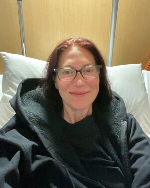 Natalie Haynes Instagram - Thanks to superhuman efforts from dozens of amazing medical staff, it looks like I am on the mend. Please keep sending your prayers to Asclepius and Hygieia - there’s still work to do. But I am feeling much stronger, so I’ll try to keep that up!

(Thanks to my pal L for getting me some gothier clothes, now I’m allowed to wear my own again 🖤)