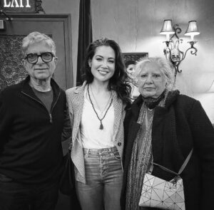 Natalie Mendoza Instagram - This photo means more to me than anyone could ever know. 
To begin one’s spiritual journey humbly at 16 with a yearning to understand life and with only a couple of tiny books in hand, Return of the Rishi and 7 Spiritual laws to success penned by Deepak Chopra one might say I was fortunate enough to orient myself in a way that I’m sure took many lifetimes to find. 
I look at this photo taken last night and realize now … hey it all worked. 
I met my first teacher Deepak.
My heart is full, I feel peace and I have been able to play in the realms of abundant love, creativity and joy ever since. 
What a journey it’s been. Learning Transcendental Meditation, later finding Maharishi. 
There were so many peaks, literally Himalayan peaks and equally as many valleys that I encountered along the way but to look back and realize I was able to maintain a sense of quiet peace and kindness in my heart… well that is how I measure my journey. 
And here I am today. Fulfilling an old dream and healing an old wound of finally being able to play a dream role on Broadway @moulinrougebway 
All in the midst of losing loved ones and my mama , a dancer who taught me so much but now hasn’t the literal mind to even understand what I’m doing in this moment and my pa who is blind who can’t see what it is I dreamed of achieving. So I’ve been left to wonder what truly matters? 
— Long Covid took me into another long test where having breath in my lungs and only moderate pain became how I measured my day. 
To suddenly get through a two show day yesterday and feel almost like my old self couldn’t have happened in a more poignant and fulfilling moment of being able to finally meet the man who guided me from my teens to Rishikesh to half way around the globe and back to Broadway during the insanity of a pandemic. Having few tools except the practice of TM and the wisdom of my few teachers and healers. I could finally see the magic in it all.
Thank you is all I can say, thank you @gchopra Ma and Pa Chopra. It truly was an honor to share the gifts I’ve received all by the Grace of your own spiritual offerings to the world. 
Jai Guru Deva #grateful 🙏🏽🤍