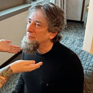 Neil Gaiman Instagram - Today I had the first fitting of the Dickens Beard. It looks incredibly real. Tomorrow it will be worn with hair and clothes and will be very Dickensian indeed. @loryn_pretorius made the beard and applied it and is seen here discussing making me into Mr D tomorrow.

Still a handful of tickets left for Monday and several big handfuls of tickets for Tuesday. NY town hall...