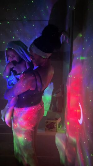 Nia Holloway Instagram - Our bedtime routine just got a lot more special with our  @theplutodreamlight ! We’re always looking for ways to bring something new and exciting to our everyday task and The Pluto Dreamlight did exactly that !  The Pluto Dreamlight has 7 different colors, optionable shooting stars   moon, bluetooth speaker and even a wireless remote, so there are plenty of different options to turn your room into a starlit night. Huge thank you to @theplutodreamlight , Cairo’s favorite new edition to bath time ! Use my code NIAH for 20% off your order ! 🌗 #ad #plutodreamlight #bathtime #bedtime