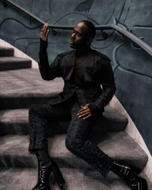 Nicco Annan Instagram - Imagery ♠️
The plot thickens for NYFW 2022 w/ lush luxury legacy. 

Photography: @thedrk_knight Styling: @icontips 
Suiting: @kamsitcharles 
Eyewear: @ditaeyewear @timeless_framework 
Shoes: @shopsyro 

Beyond grateful to stand in the sun and occupy space for the non traditional.  #NYFW 2022