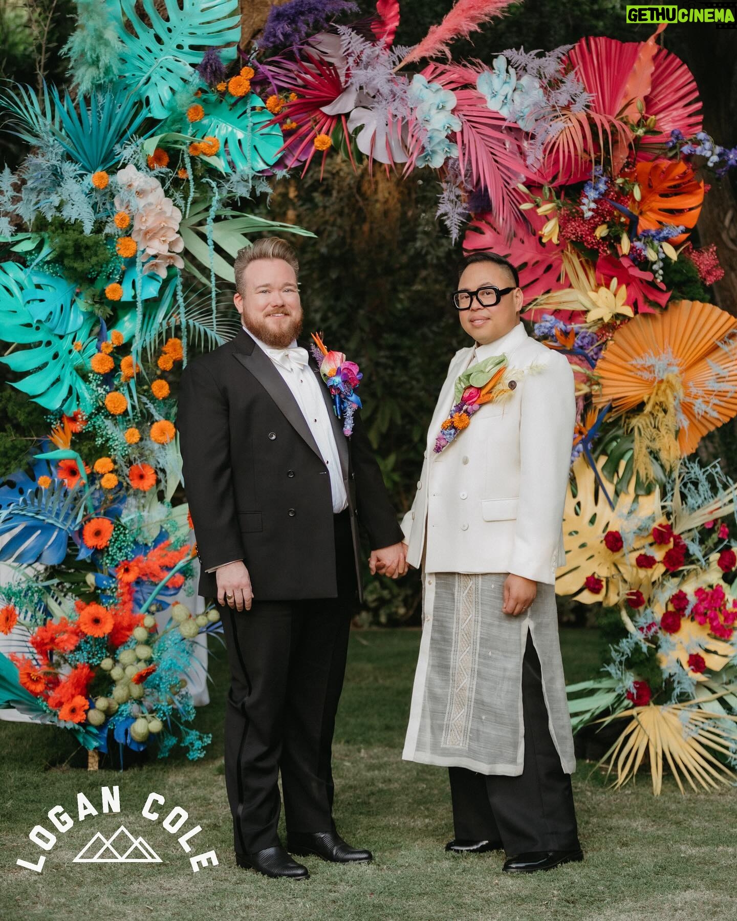 Nico Santos - 26.9K Likes - Ok reposting coz some pics weren’t showing up…Wanted to share some more images that our incredible photographer @logancolephoto captured on the big day...
My husband @zekerchief is the cutest 😍😍😍
A lot of y'all have been asking about my wedding look so here's the breakdown:
Boutonnière: @cobralily of course! I wanted a statement and I got it!
Frames: custom made by @romainkayo_eyewear! They have these lovely brass magnetic purple ombré sunglass lenses that I made good use of when the sun was blaring..
Jacket: @driesvannoten that I got online for like 80% off. I've had my eye on this jacket forever (she loves a good deal henny!) but chose it because the shoulders was giving slight Filipiniana Terno vibes.
Barong/Pants: custom made by the amazing @veejayfloresca! I knew I wanted an extra long barong because I wanted it to evoke bridal. And wide leg pants coz that's all I'm wearing nowadays lol
Shoes: @paulsmithdesign, the first pair of tux shoes I ever bought years ago!
But also LOOK AT THESE FIERCE QUEENS!!! @justjolopez @nebuyaystyles and @aianashaw gave us EVERYTHING and made the night even more memorable.
🩷❤️🧡💛💚🩵💙💜🤎🖤