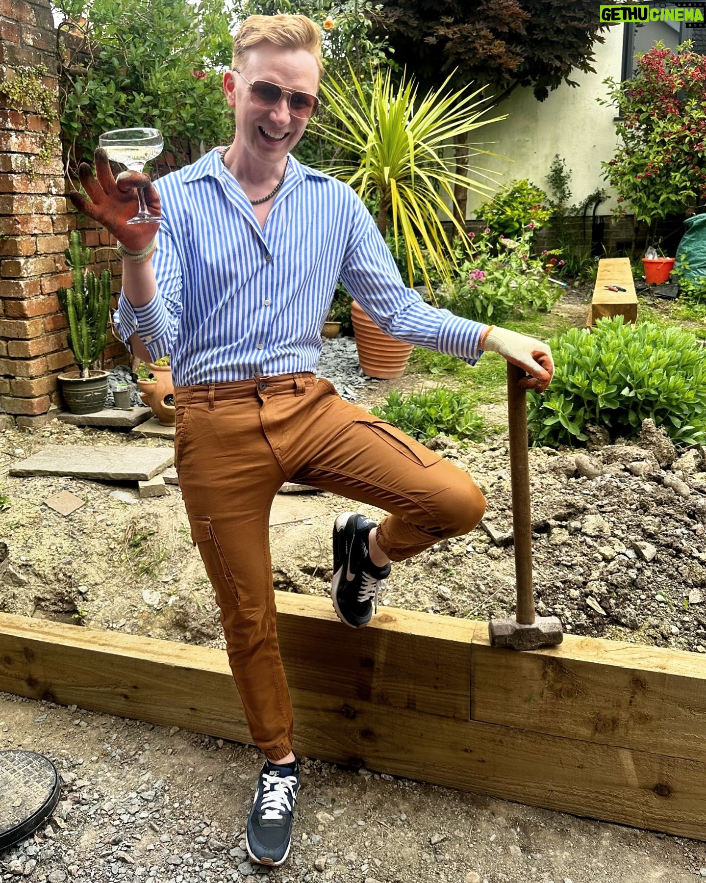 Owain Wyn Evans - 2.9K Likes - Spirit level working overtime today 🔨 Been building a retaining wall for the garden using sleepers and now I am v thirsty! Quick outfit change for the final inspection 😂 Hope you’re having a productive Saturday dahlings, or if not… at least a gorgeoux one! xxx