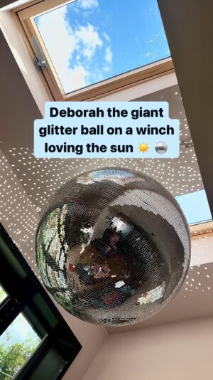 Owain Wyn Evans Instagram - With these sunnier days Deborah the giant glitter ball on a winch is pure joy 🥰 ✨ She also still loves to be cranked down into the spotlight of an evening… don’t we all?! 😂 🪩 

She brings sparkle to our Drinkette Loungette every day. 

We limit Deborah’s time in strong sunshine - believe it or not… glitter balls & disco balls can actually cause fires if put near flammable objects in strong sunshine. The winch is perfect for this, as she can be wound down out of the sunlight if needed 💡 

#homereno #discoball #homedisco #glitterball #glitter #homerenovation #ukhomeinspo #ukhome #imadethis #homeclub #kitchendisco #diy #doityourself #doityourselfproject #homestyledecor #homestyle #houserenovation