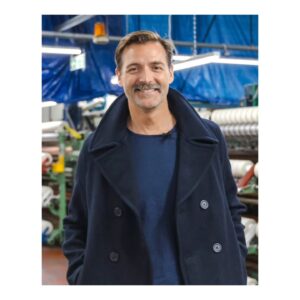 Patrick Grant Instagram - At @community_clothing we buy our cloth from the UK's finest textile mills. Take a whizz round the fantastic 240 year old @awhainsworth mill in Pudsey in West Yorkshire with this grinning wool lover. See how they make the amazing melton cloth from which we sew our mens peacoats. See the film on the Stories section of the Community Clothing website (link in bio)

Big thanks to @campaignforwool for filming the trip.